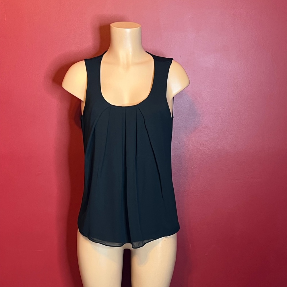Free second-hand black dressy camisole with the purchase of one of our bundles.